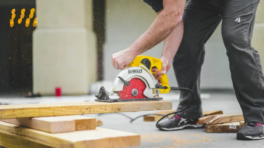 Contractor cutting lumber on a job site