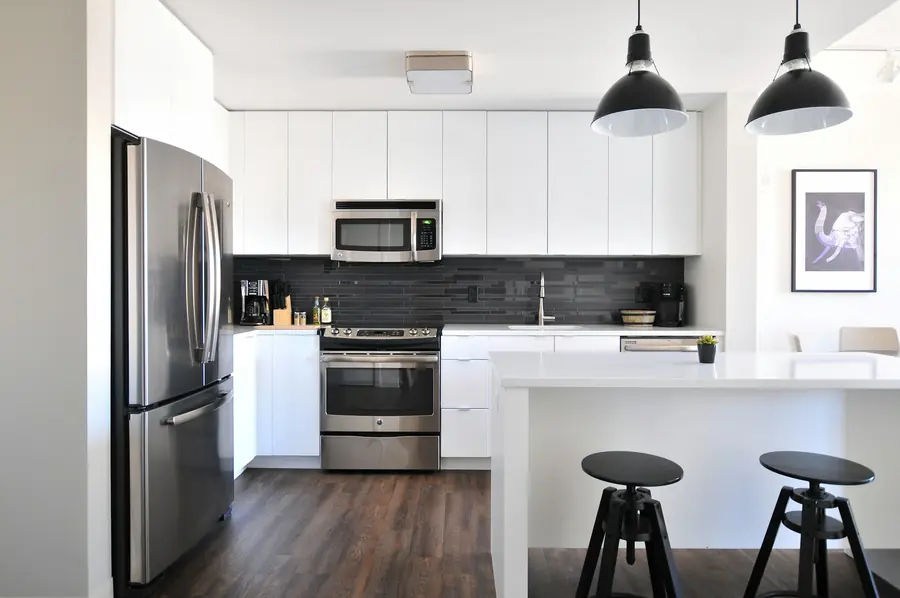 Bright modern kitchen with pendant lights over an island